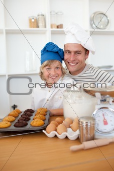 Father and son presenting their muffins
