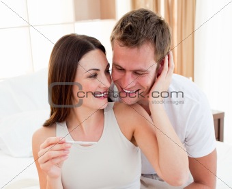 Cheerful couple finding out results of a pregnancy test 
