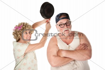 Woman swinging frying pan at husband