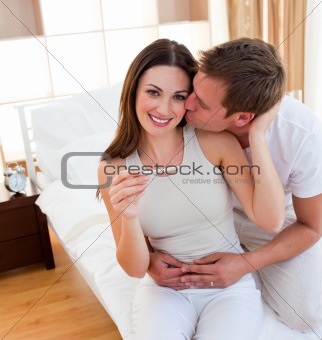 Attentive couple finding out results of a pregnancy test