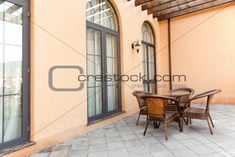 Patio with rattan chairs and table