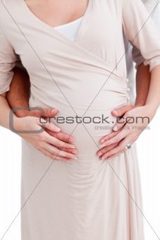 Close-up of a pregnant woman with her husband