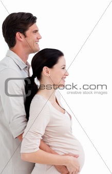 Portrait of a cheerful pregnant woman with her husband 