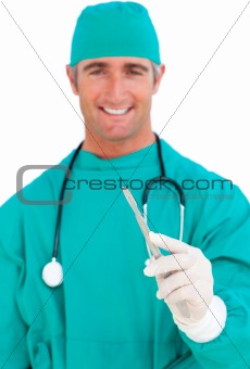 Attractive surgeon holding a scalpel
