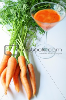 shot of fresh squeezed carrot juice