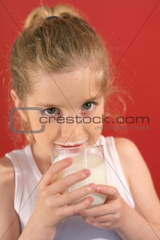 shot of a girl drinking milk with milk mustache