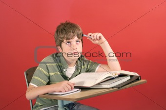 shot of a frustrated student at his desk