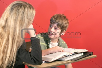 shot of a mother and son doing homework smile