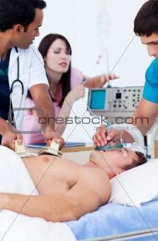 Ambitious medical team resuscitating a patient