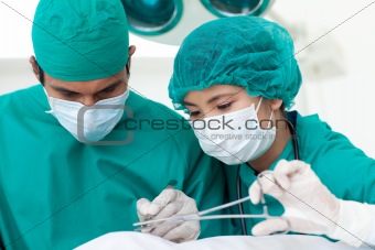 Portrait of two ethnic surgeons in operative room