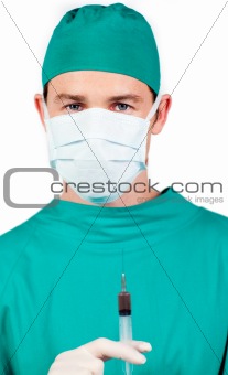 Young surgeon holding a syringe 