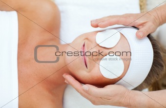 Smiling woman enjoying a head massage