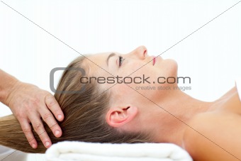 Blond woman enjoying a hair massage