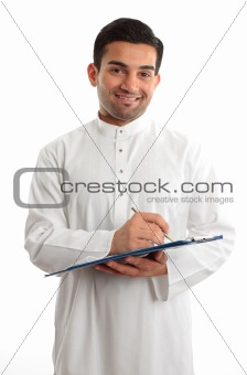 Smiling businessman writing in folder