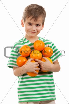 Boy holding oranges