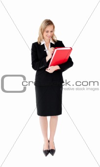 Radiant businesswoman writing on a paper