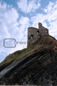 castle ruin on a high layered cliff
