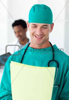 Attractive surgeon looking at a patient's folder