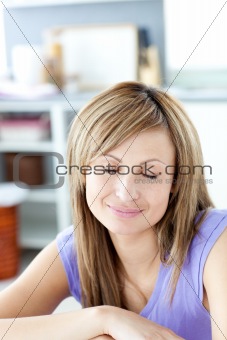 Delighted woman relaxing in the kitchen 