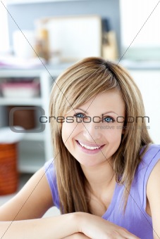 Smiling woman looking at the camera the kitchen 