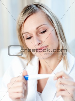 Beautiful woman finding out the results of a pregnancy test 