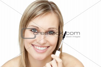 Beautiful woman holding a mascara 
