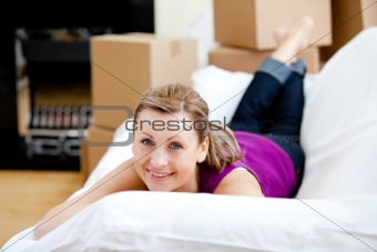 Cheerful woman having a break between boxes