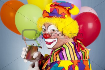 Tipsy Clown Sneaks a Drink
