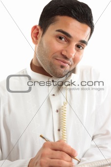 Businessman on phone call with newspaper