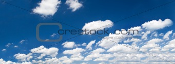 bright summer sky with cumulus clouds