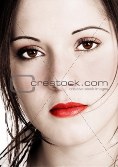 Beautiful woman with sepia look and saturated added colors 