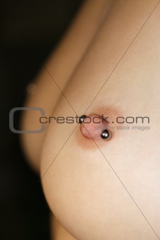 Female breasts with piercing..