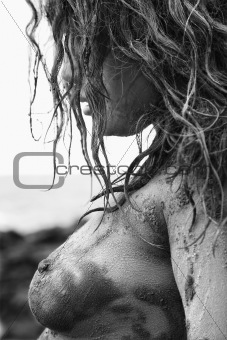 Muddy nude woman.