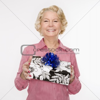 Woman holding present.