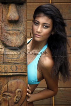 Tourquoise bikini girl and wooden totem