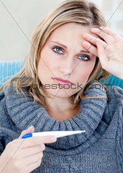 Unhappy woman taking her sick tempretaure