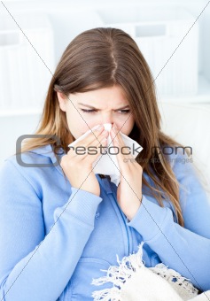 Sick woman sitting at home in her bed