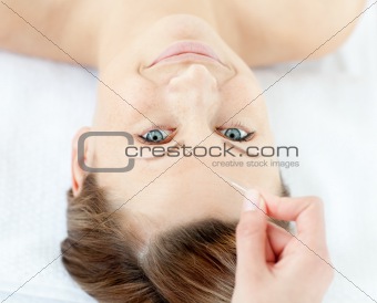 Acupuncture needles on a beautiful woman's head 