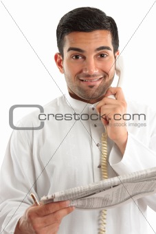 Happy businessman with financial newspaper