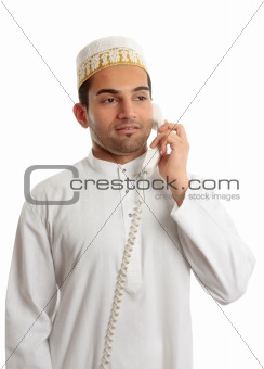 Arab man wearing white robe and topi