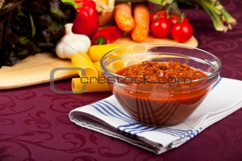 bowl with sauce bolognese and raw vegetables