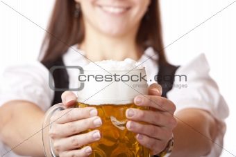 Macro of Oktoberfest beer stein held by woman