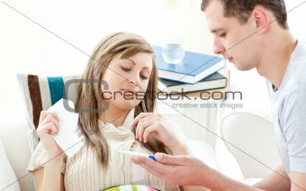 Beautiful sick woman getting pills from her boyfriend