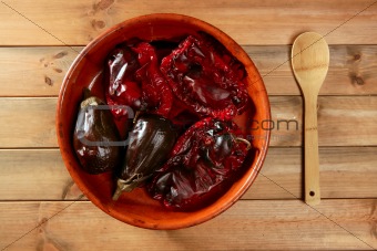 Eggplant and peppers roasted on clay vessel