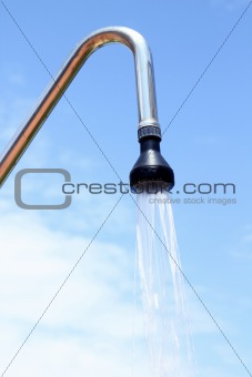 shower sprinkler on blue sky outdoor water falling