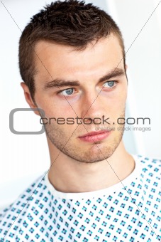 Serious caucasian patient in a hospital