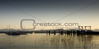 Boats On a Calm Lake at Dawn