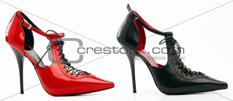 Two high-heeled female shoes with lacing