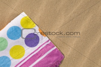 Spotted towel on sand