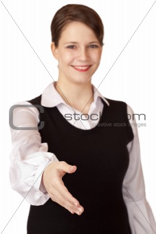 Beautiful businesswoman gives hand for handshake.
